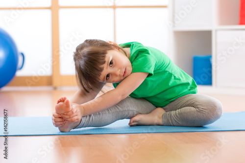 cute little girl stretching...