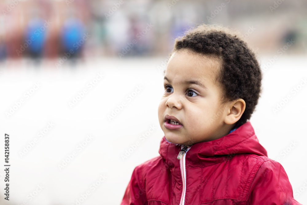 portrait of a beautiful multi racial boy making silly face portrait of a beautiful multi racial boy making silly face