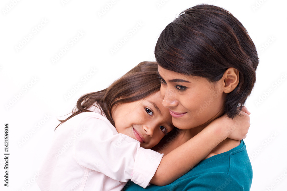 little daughter hugging her mother, concept of happy family or love little daughter hugging her mother, concept of happy family or love