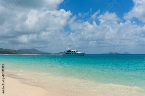 Cruise boat, ship in tropical paradise © Olga K