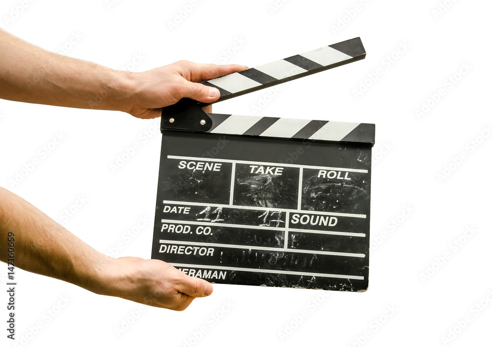 Naklejka premium Hands with a movie clapperboard isolated on white background
