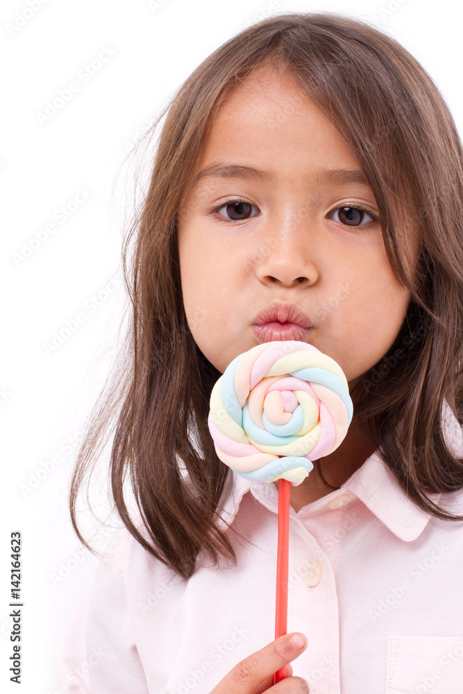 playful cute little girl posing with sweet pastel color marshmallow