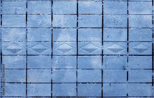 Old Tile Wall Texture Painted in Blue photo
