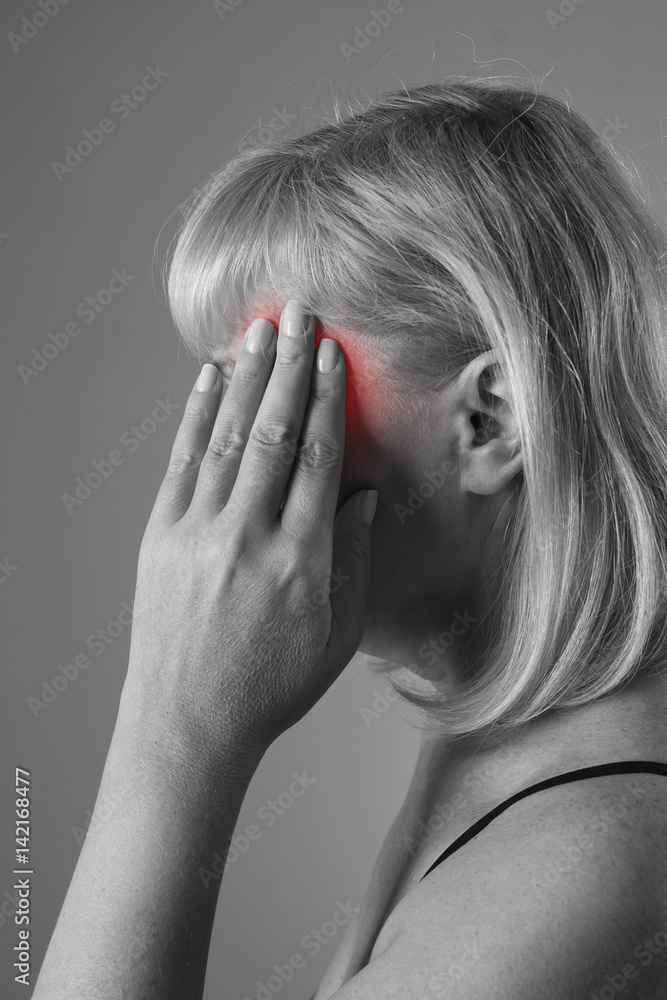 Fototapeta premium Aged blonde woman with headache, migraine and depression