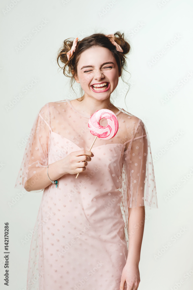 Beautiful brunette girl with candy in her hands Beautiful brunette girl with candy in her hands