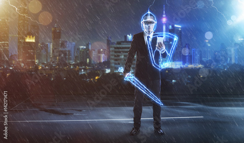 Foto Businessman turned into thunder warrior,holding a lightning sword and shield ,preparation, protection, precaution and security in business concept