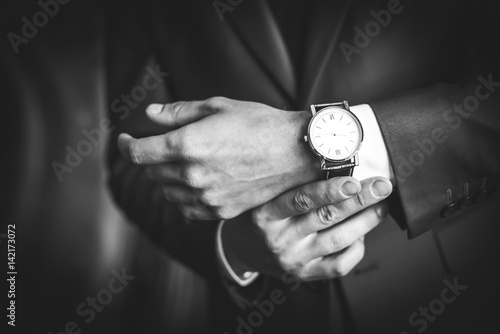 Men's hands with the clock