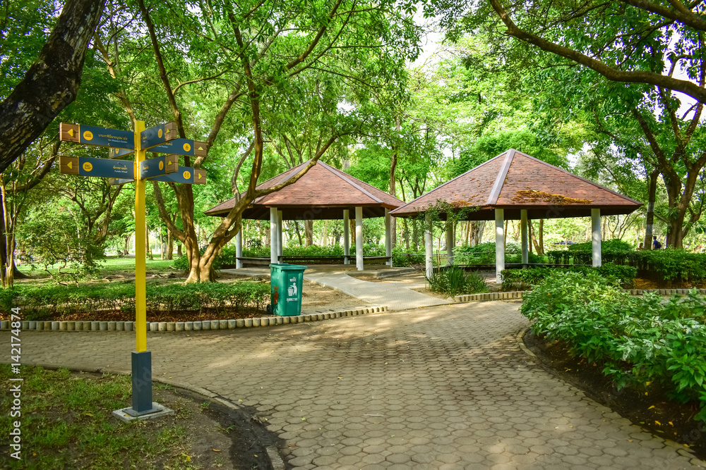 Pavilion red roof with trees around it in public park