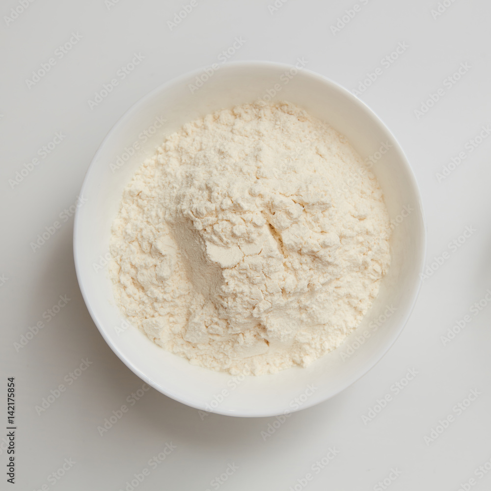 Flour in plate on white Flour in plate on white