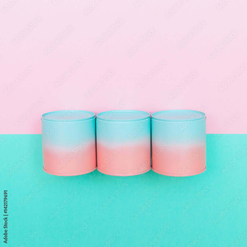 three pink and blue cans of soup with dip-dyed on mint and pink background. pastel set of fast food. minimal flat lay. three pink and blue cans of soup with dip-dyed on mint and pink background. pastel set of fast food. minimal flat lay.