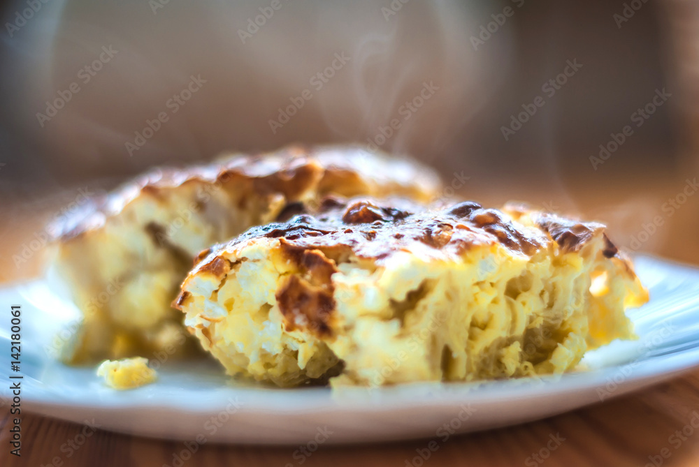 Freshly baked milk homemade pie with eggs and cheese.