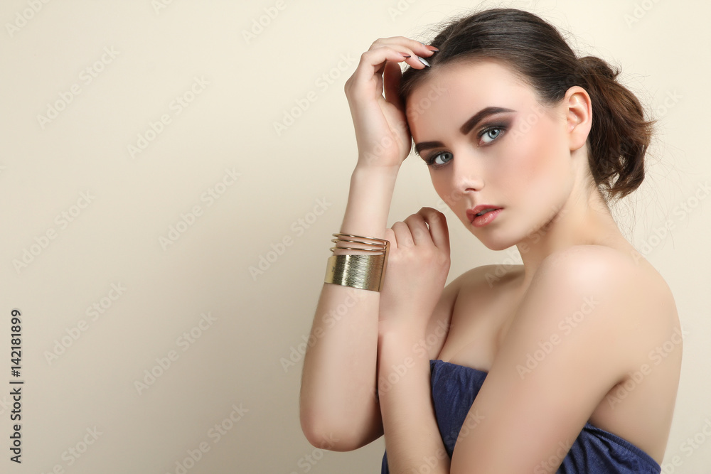 Portrait of a beautiful girl on a neutral background. Concept makeup Portrait of a beautiful girl on a neutral background. Concept makeup