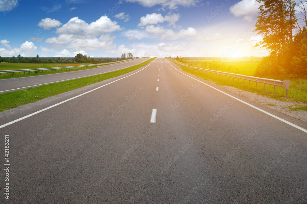 Asphalt road and clouds