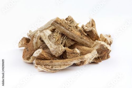 Pile of dried and sliced marshmallow root (Althaea officinalis) isolated on white background