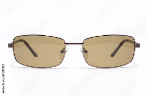 Men's sunglasses with brown glasses in metal frame isolated on white