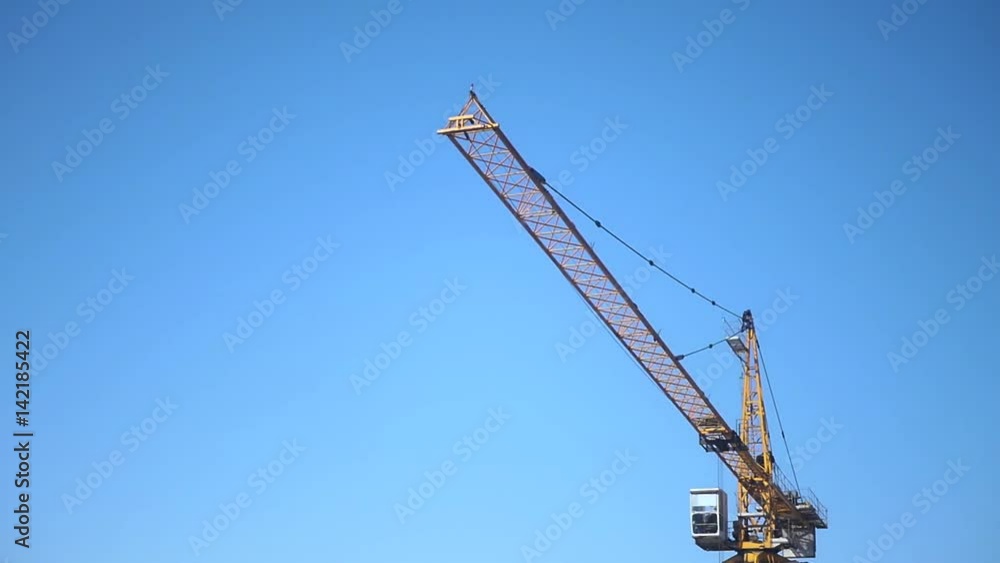Construction yellow crane on a background of beautiful blue sky. hd. Construction yellow crane on a background of beautiful blue sky. hd.