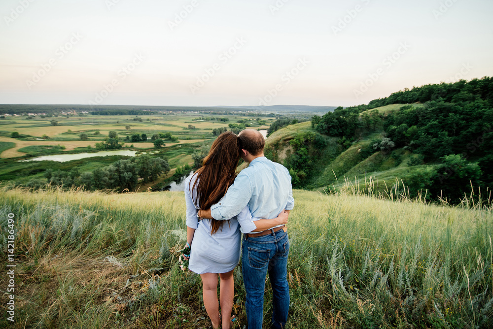 Couple on a hill