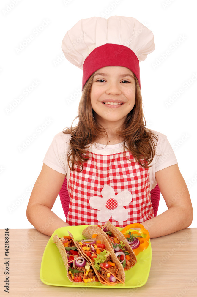 happy little girl cook with tacos on table happy little girl cook with tacos on table