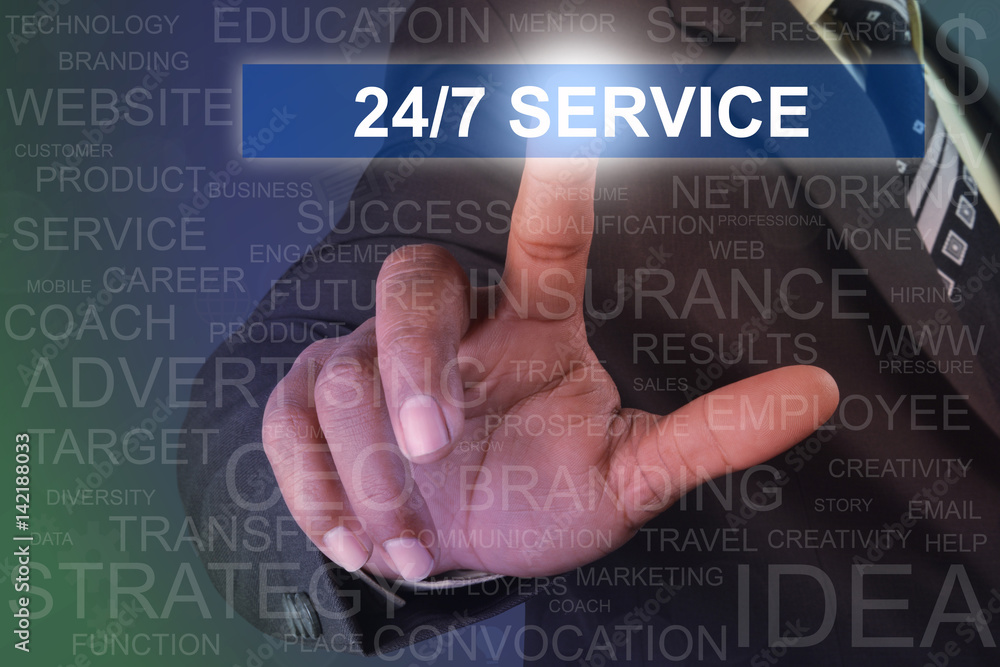 Businessman touching 24-7 service button on virtual screen Businessman touching 24-7 service button on virtual screen