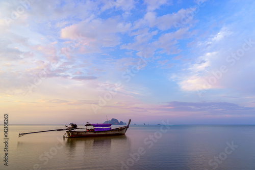 Traditional thai boats at sunset beach. Ao Nang Krabi province
