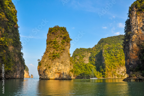 Yacht in the sea among the rocky islands