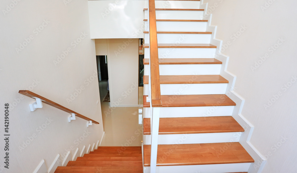 The modern wooden stair way in home The modern wooden stair way in home