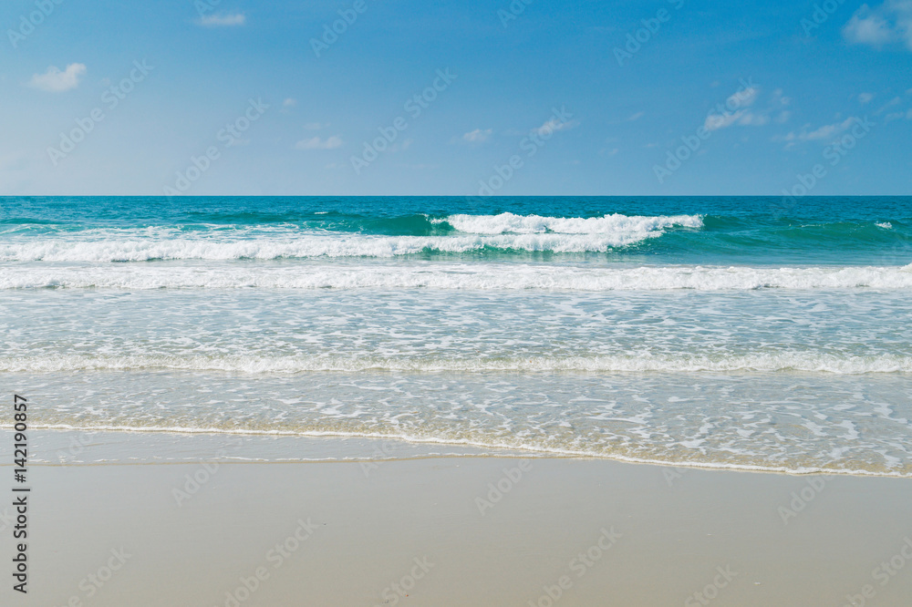 Tropical beach with clear water and blue sky