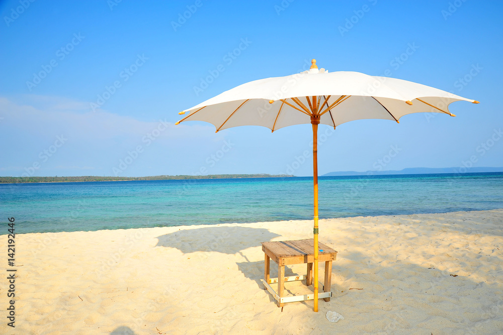 White Sand Beach with Beach Umbrella in Summer Season