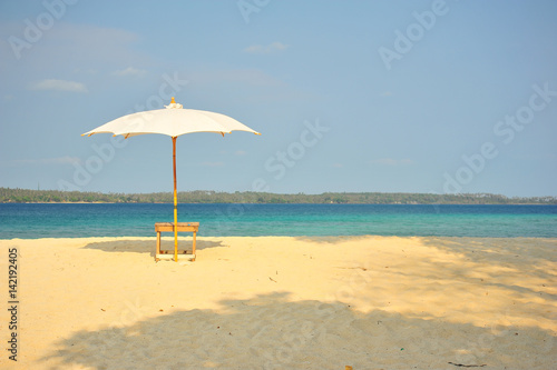 White Sand Beach with Beach Umbrella in Summer Season