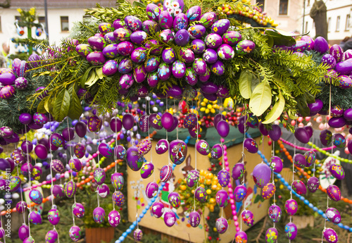 Easter fountain. Osterbrunnen. Traditional german easter eggs outdoor decoration. 