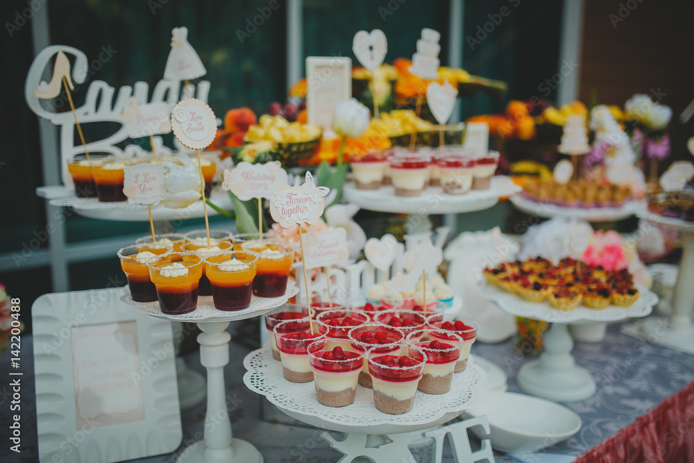 Beautiful sweets on buffet table with decorations