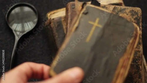 Putting down vintage books and the Bible.