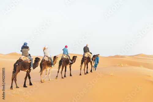 Photography Tourist people ride on dromedary.