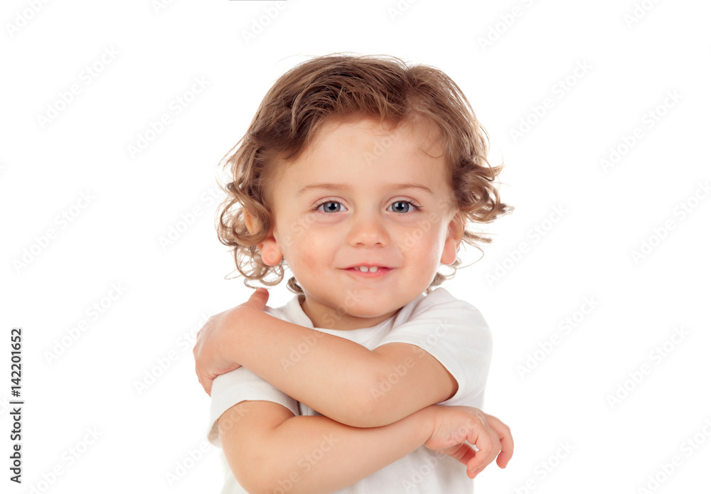 Adorable baby with curly hair playing to hugging Adorable baby with curly hair playing to hugging
