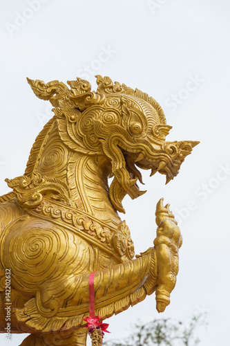 Gold Singha statue or lion statue on white background
