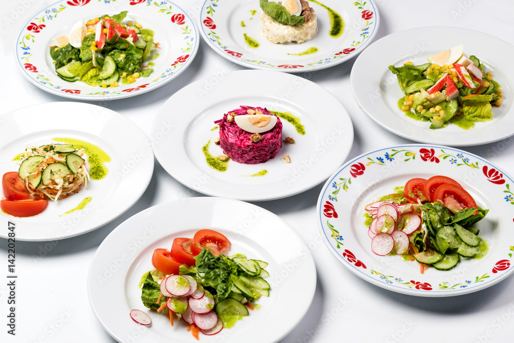 Different spring salads in plates