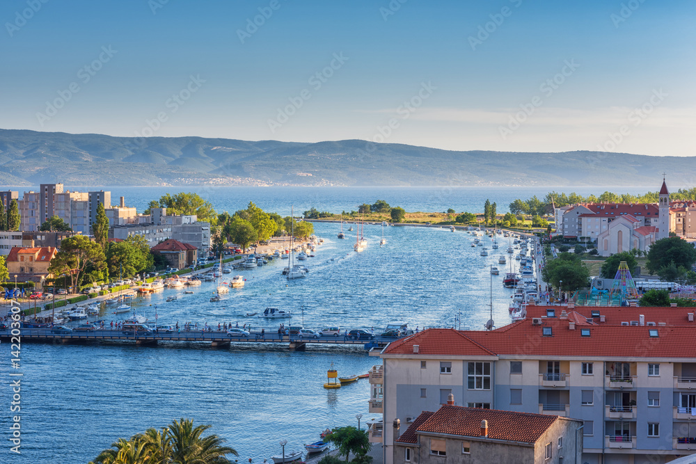 Aerial view of the cozy Croatian town Omis and island Brac where the river Cetina flows into the Adriatic Sea, Dalmatia, Croatia