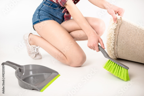 Woman with scoop and brush