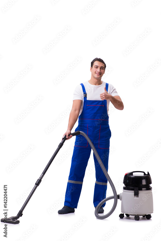 Man in coveralls doing vacuum cleaning on white Man in coveralls doing vacuum cleaning on white