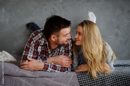 The young woman holds on hands of the little son.