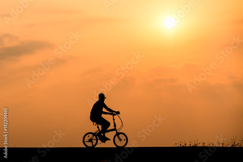 Wallpaper Mural Silhouette of cyclist on sunset background Torontodigital.ca