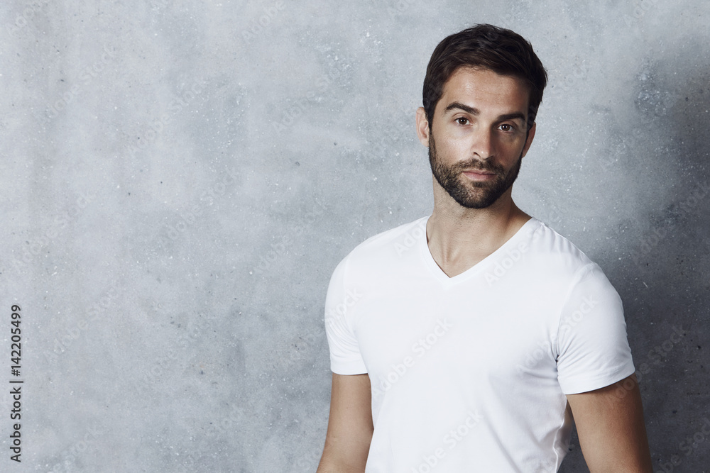 © sanneberg - Portrait of white t-shirt guy in studio © sanneberg - Portrait of white t-shirt guy in studio