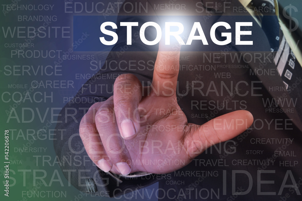 Businessman touching storage button on virtual screen Businessman touching storage button on virtual screen