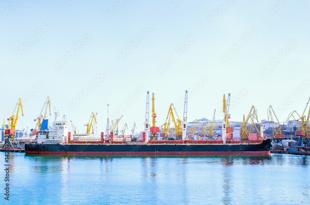bulk carrier ship in the port on loading.