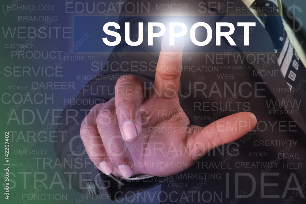 Businessman touching support button on virtual screen Businessman touching support button on virtual screen