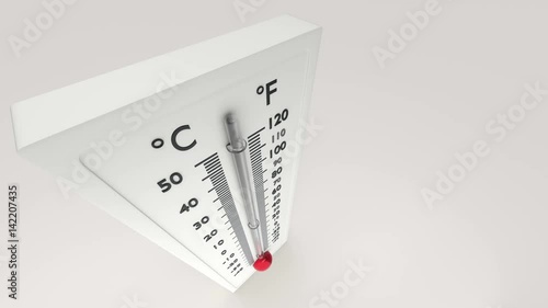 View of a thermometer from above in which the temperature gauge grows.