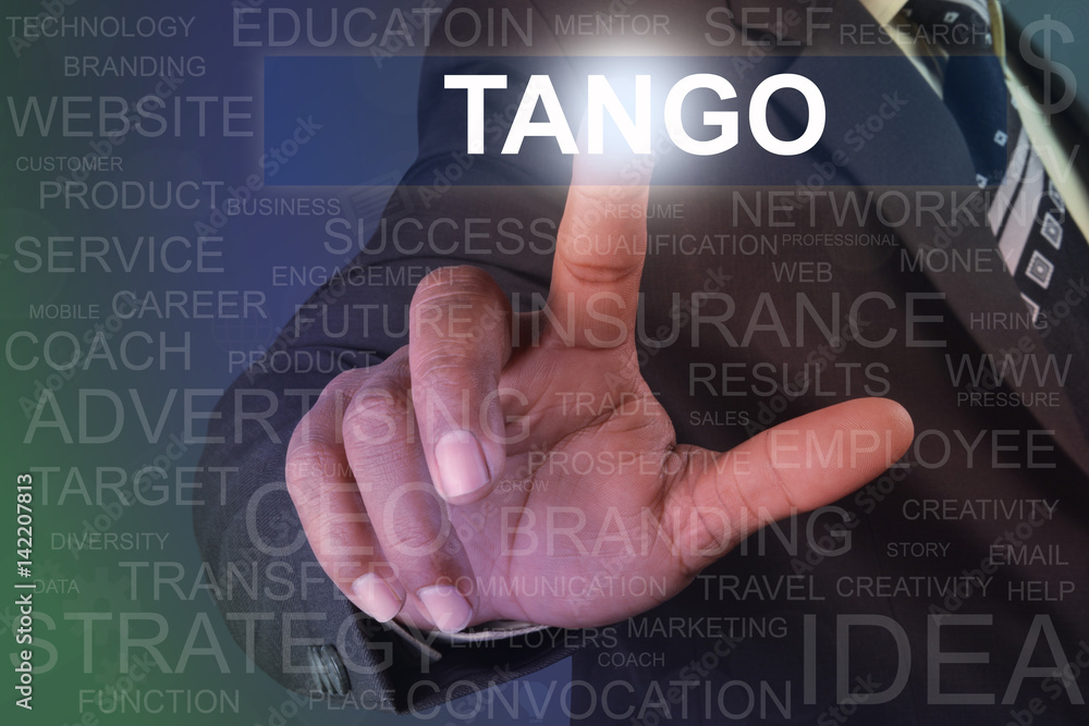 Businessman touching tango button on virtual screen Businessman touching tango button on virtual screen