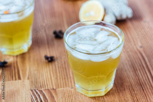 Alcohol free home ginger beer on glass on wooden surface