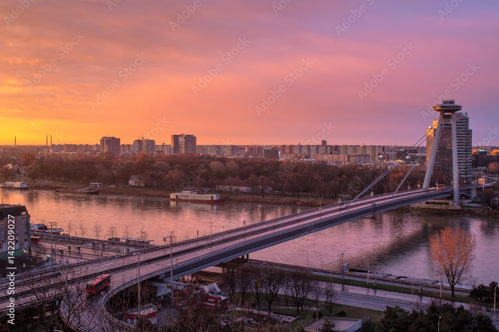 Bratislava, Slovakia - March 19, 2017: New Futuristic Bridge in Bratislava at sunset (City view at sunset)