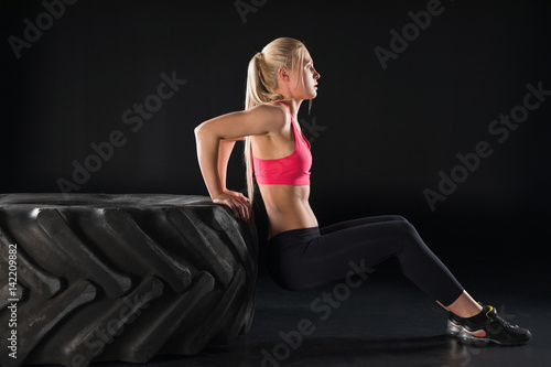 sporty woman with tire